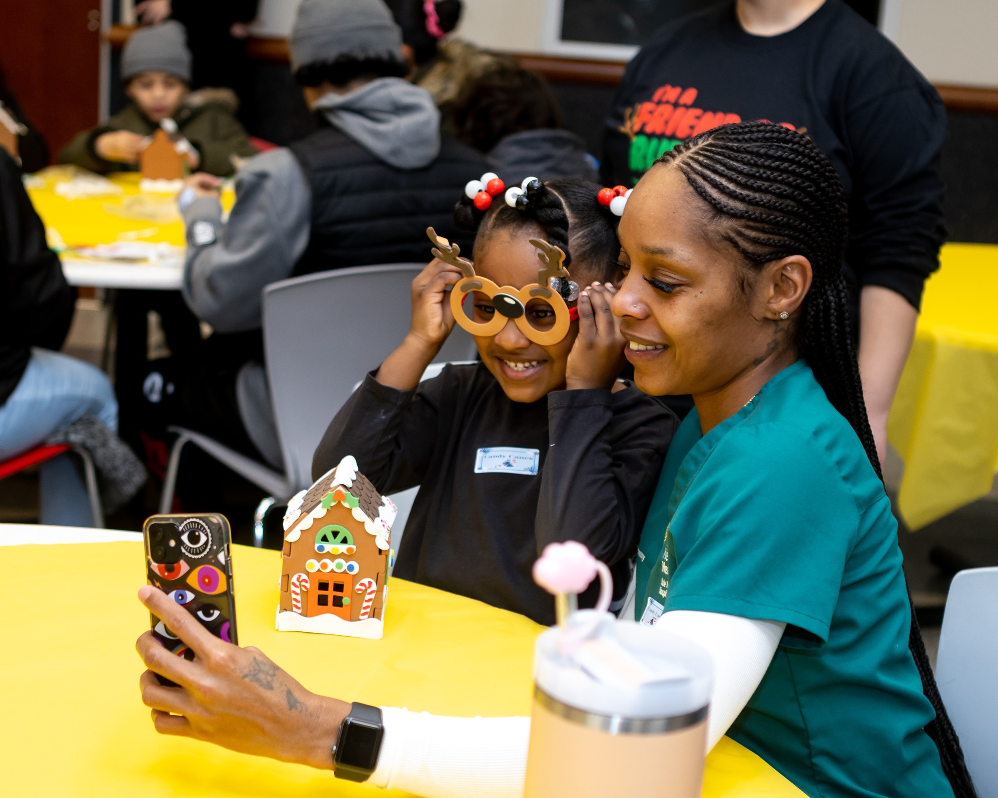 Woman taking a selfie photo with a child