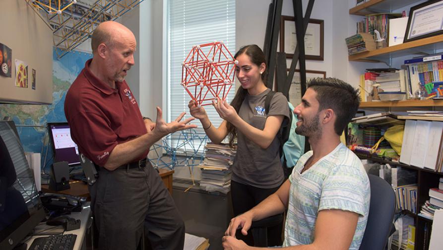 Students meeting with professor