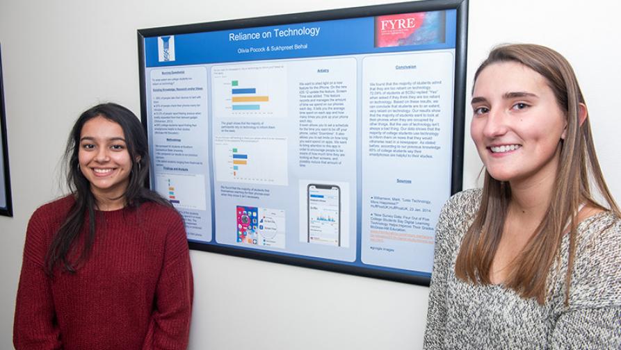 Students in front of capstone project