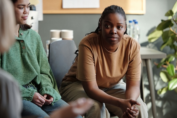 Woman listening to a discussion