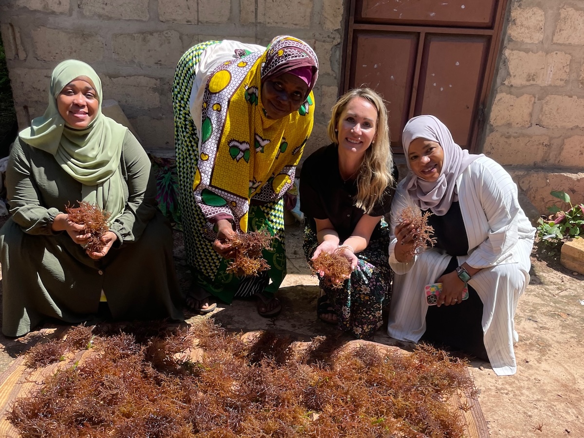 Miriah Kelly and three other women showing cleanup work