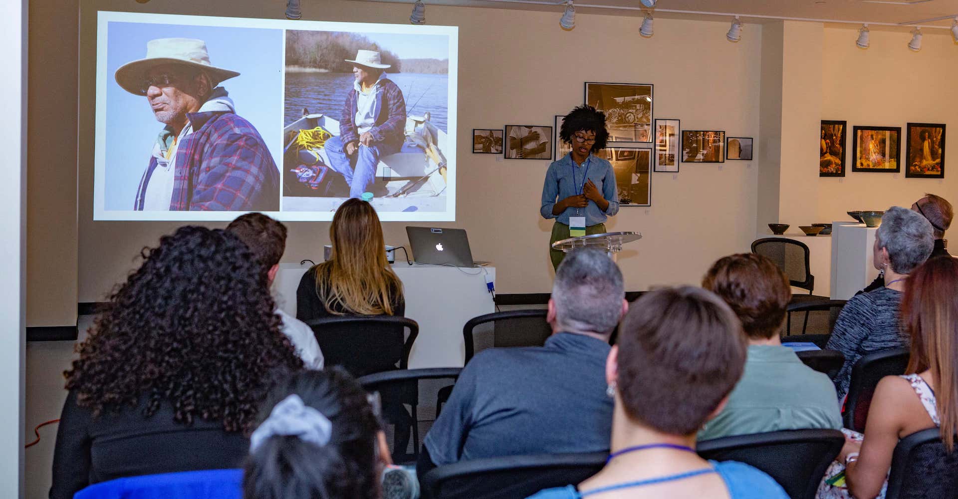 A group of students in a classroom setting with the professor