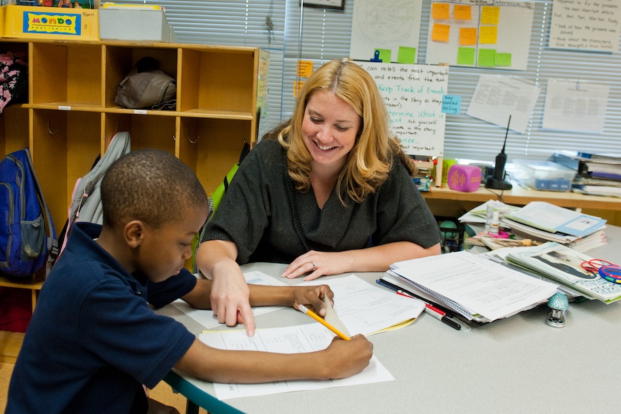 Teacher with a student in the classroom